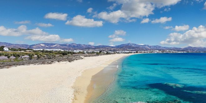 Long stretch of golden sand and turquoise water at Agios Prokopios in Naxos, Greece