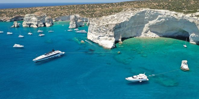 Volcanic rocks and sail boats at Kleftiko in Milos island, Cyclades, Greece