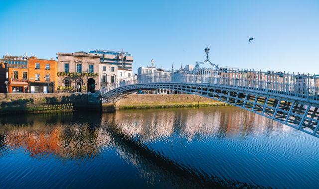 View of Ha’penny Bridge over the River Liffey in Dublin, Ireland
