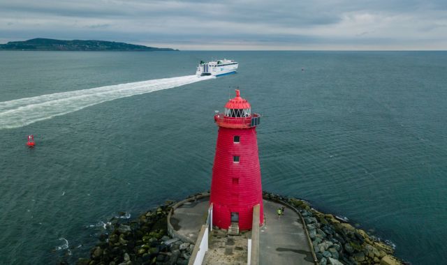 View of ferry and Poolbeg lighthouse in Dublin, Ireland
