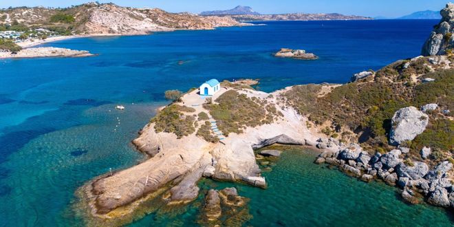 Small church in front of Agios Stefanos beach in Kos island, Greece