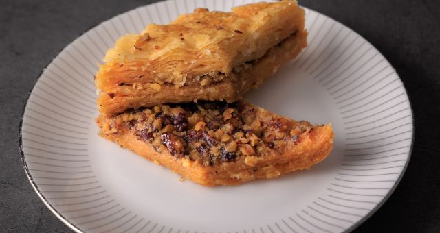 A traditional Bakllava sweet with filo pastry and syrup in Vlorë