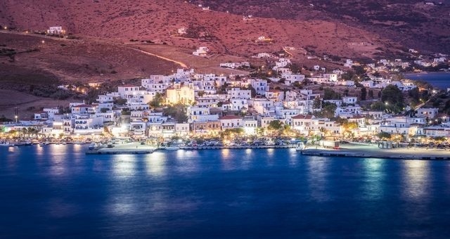 The illuminated port and village of Gavrio by night, Andros