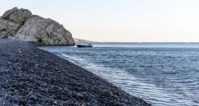 Black pebbles near the sea in Chios, Greece