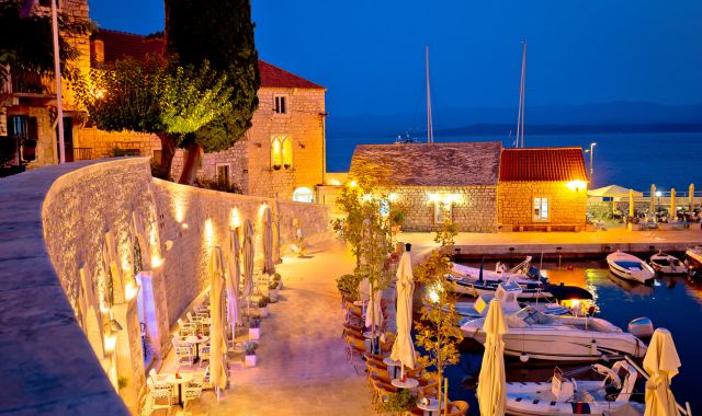 Night view of a marina area in Bol, Croatia