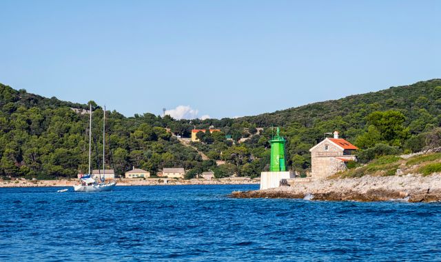 The entrance to the port of Mali Lošinj and its green lighthouse, Croatia