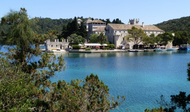 Aerial view of marine salt lake with Benedictine monastery in St. Mary’s island, Mljet