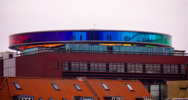 Visitors walking along the rainbow-coloured walkway at ARoS Aarhus Art Museum