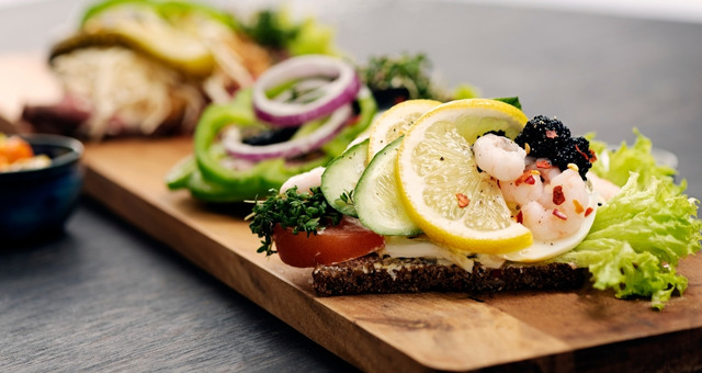 Smørrebrød, a Danish open-faced sandwich with vegetables, fish or meat