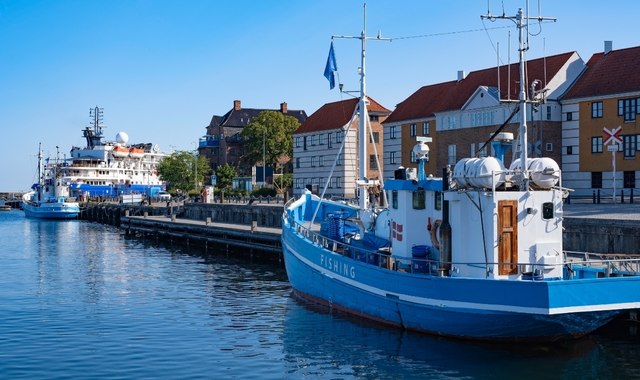 A ferry and 2 fishing boats docked at the port of Elsinore, Denmark