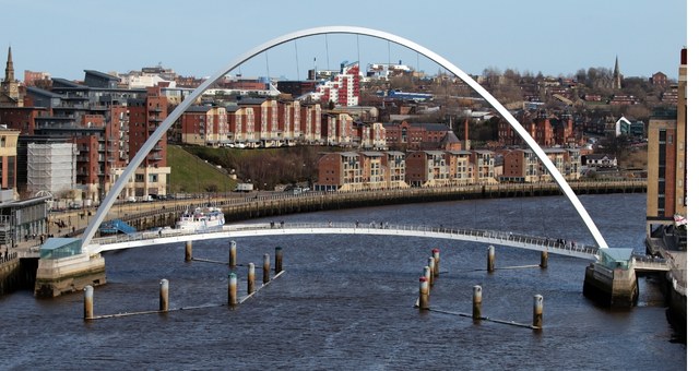 The Gateshead Millennium Bridge soaring over the Quayside area of Newcastle