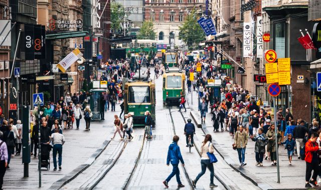 People walking near tram lines in Helsinki, Finland