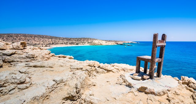 rocks, blue sea and sky, wooden chair, landscape