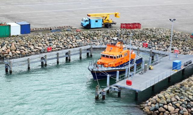 Orange lifeboat docked at the port of Rosslare, Ireland