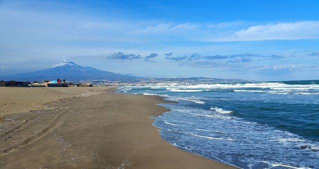 Playa di Catania, a free-to-access beach in Catania, Italy, with a view of Mount Etna