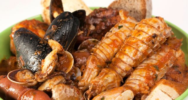 A plate of seafood cacciucco soup, Livorno's signature dish