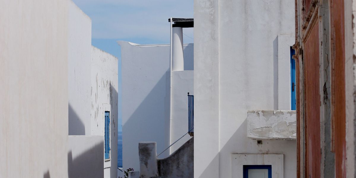 Panarea's white houses close to the harbor, Italy