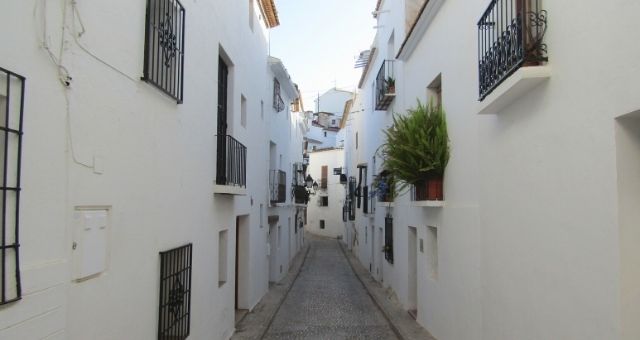 The typical white houses in an alley of Malfa, in Salina, Italy