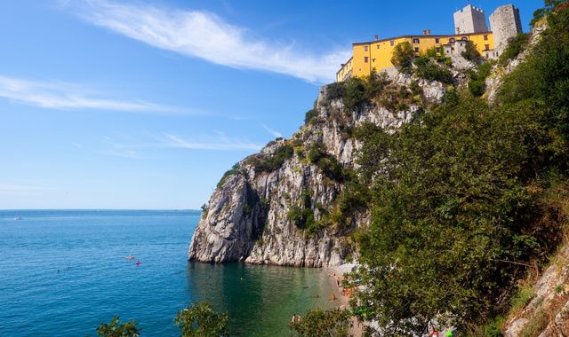 Spiaggia del Principe at the foot of the Duino Castle in Trieste, Italy