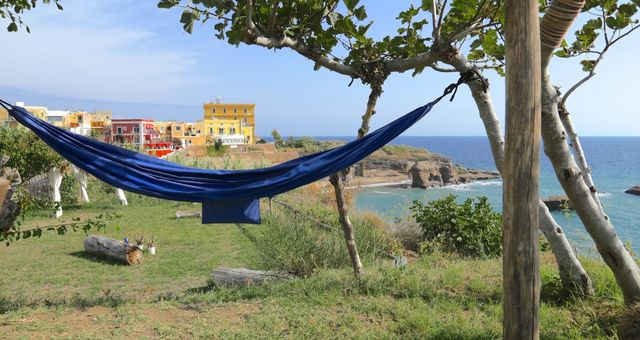 Blue hammock overlooking the town of Ventotene, Italy