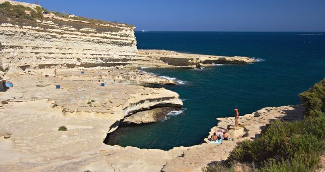 The white cliffs and blue waters of St. Peter's Pool, Malta