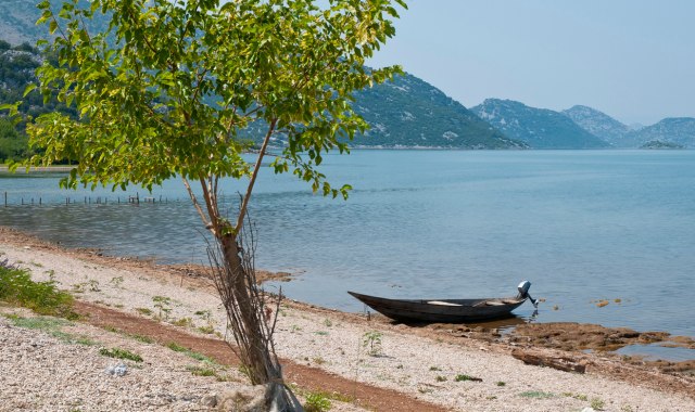 Small boat on Murići beach at Lake Skadar, Bar, Montenegro