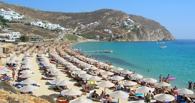 The busy beach of Elia in Mykonos, Greece