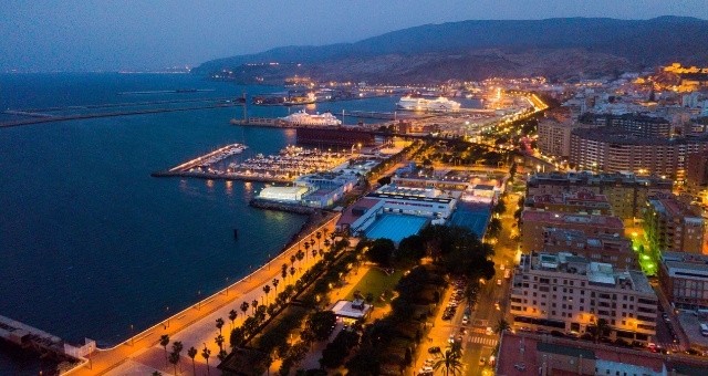 Night view of the port of Almería, with a panoramic perspective of the harbor and the city's skyline, Spain