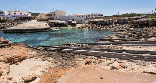 Wooden boathouses at the village of Es Caló de Sant Agustí in Formentera, Spain