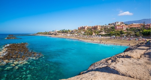 The crowded El Duque beach in Tenerife, Spain