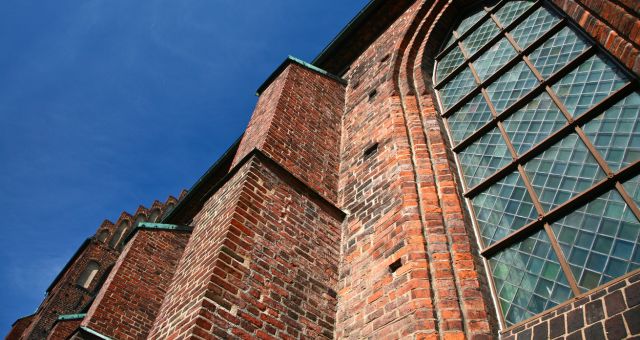 Red brick walls and stained-glass windows at St. Mary’s Church in Helsingborg