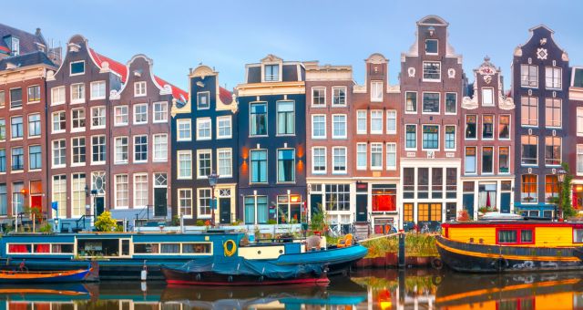 View of canal parked boats in Amsterdam