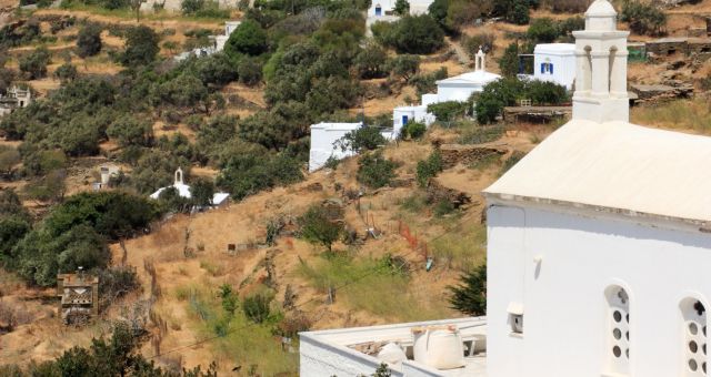 White chapel in a village of Tinos